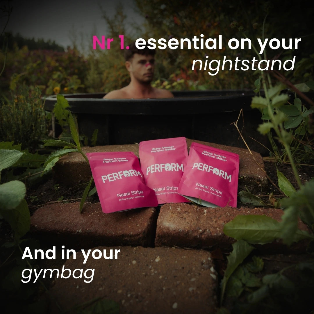 Pink nasal strip packages labeled 'Perform' on a stone ledge with a blurred ice bath in the background