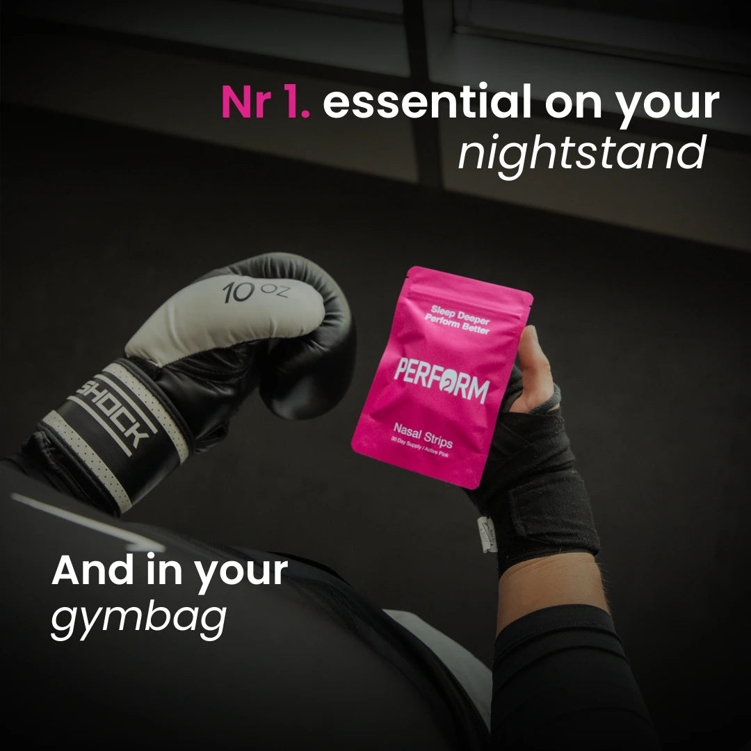 Person holding a pink 'Perform' package with boxing glovesbackground